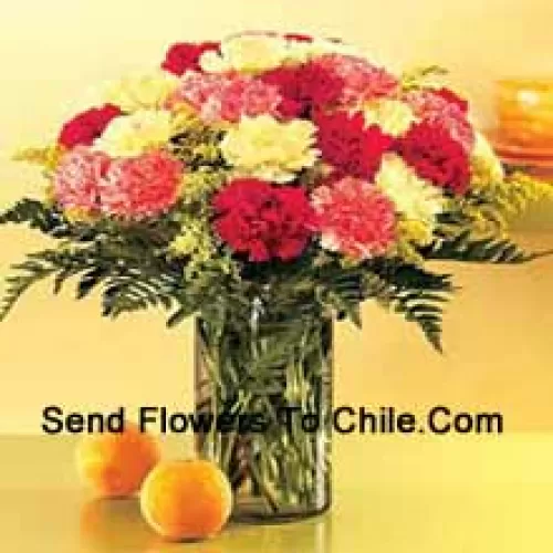 25 Mixed Colored Carnations With Seasonal Fillers In A Glass Vase