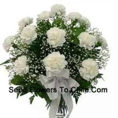 19 White Carnations With Seasonal Fillers In A Glass Vase