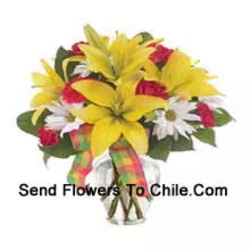 Yellow Lilies, Red Carnations And Suitable Seasonal White Flowers Arranged Beautifully In A Glass Vase