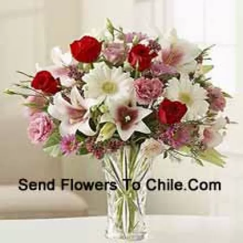 Red Roses, Pink Carnations White Gerberas And White Lilies With Other Assorted Flowers In A Glass Vase