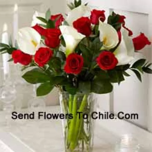 Red Roses And White Lilies With Some Ferns In A Glass Vase