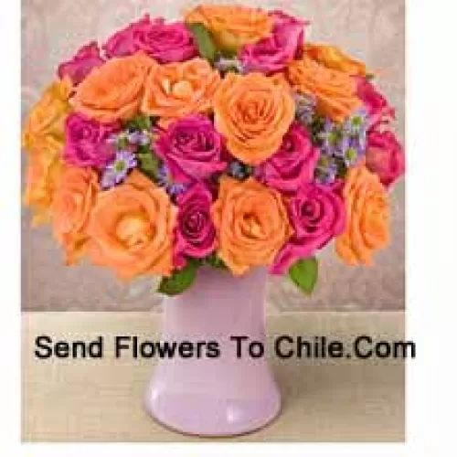 15 Pink And 10 Orange Roses With Seasonal Fillers In A Glass Vase