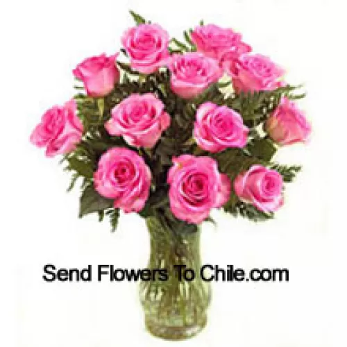 11 Pink Roses With Some Ferns In A Vase