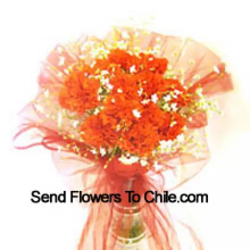 11 Orange Carnations With Some Ferns In A Vase