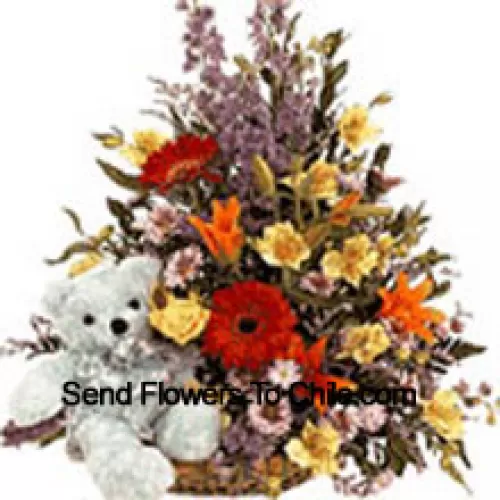 Panier de fleurs assorties avec un mignon ours en peluche