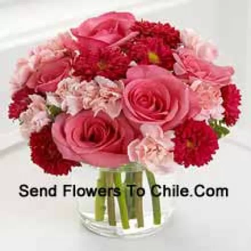 7 Pink Roses, 10 Red Colored Daisies And 10 Pink Colored Carnations In A Glass Vase