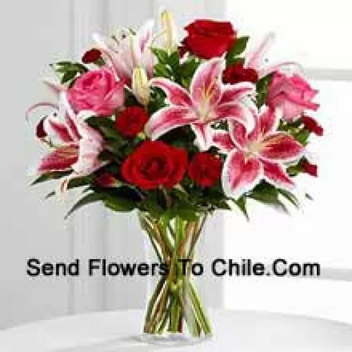 Red And Pink Roses With Pink Lilies And Seasonal Fillers In A Glass Vase