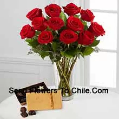 11 Red Roses With Some Ferns In A Vase And A Box Of Godiva Chocolates (We reserve the right to substitute the Godiva chocolates with chocolates of equal value in case of non-availability of the same. Limited Stock)